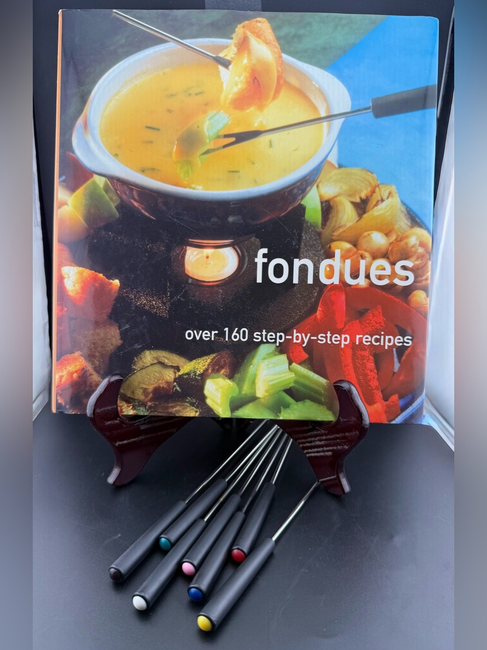 Hardcover cookbook Fondues: Over 160 Step-by-step Recipes. Stella Caldwell 2003